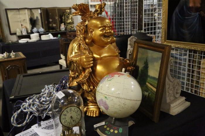 painted Buddha, globe, clock, paintings. These images are only a portion of what is available at this sale. 