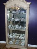 Ashley Millenium Display china cabinet with mirrored back.