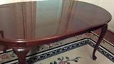 mahogany table with leaf,,,,,,,very nice,,,,,also we have a very nice wool rug in this area
