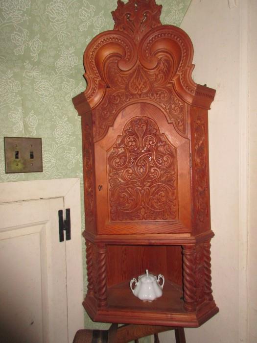 Beautifully hand carved corner hanging cabinet