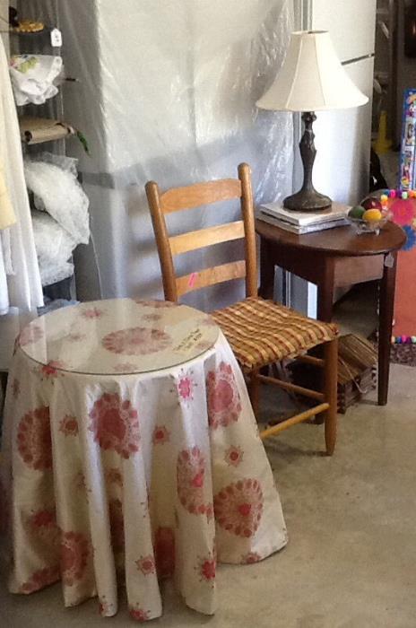 Custom made table skirt, with table & glass topper.  Pine ladder back chair, pine table, lamp.