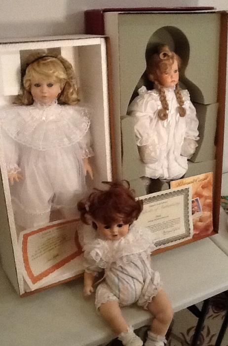 Collectible dolls with certifications.
