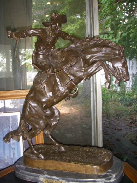 "Bronco Buster" by Frederick Remington, later casting
