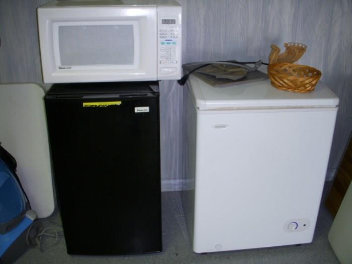 Apartment size refrigerator (black), small chest freezer and microwave