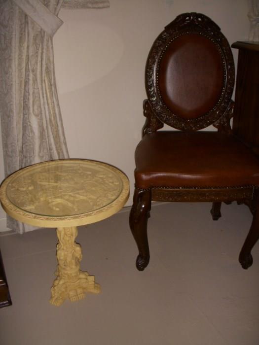 "Carved" resin table with carved wood chair