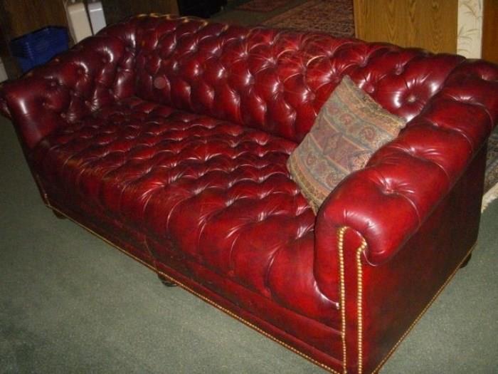 Leather "Chesterfield" sofa, has a button missing...