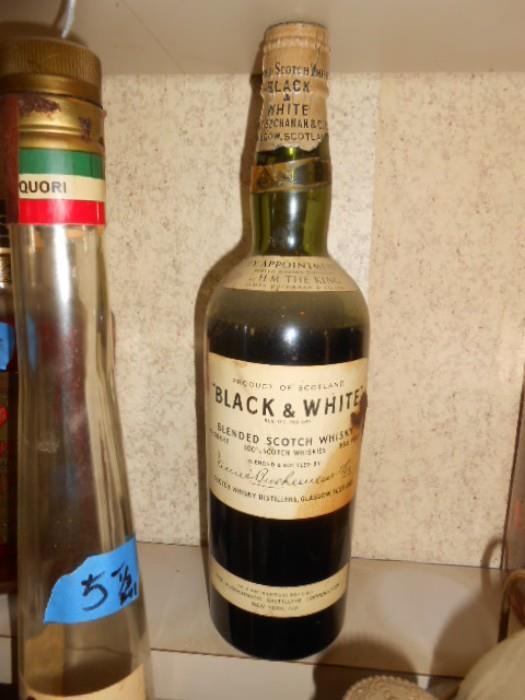 Vintage Black & White Scotch from the 1960's , unopened, unusual cap seal.