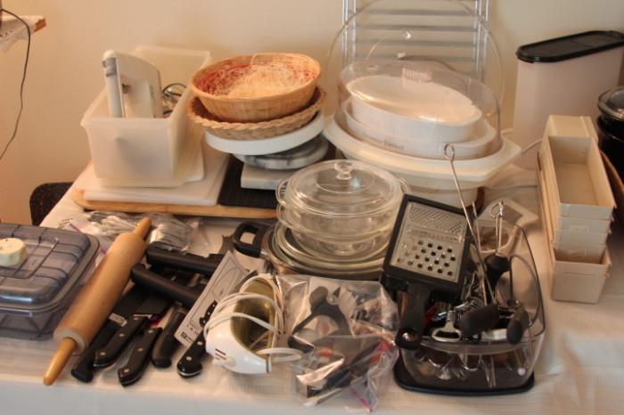 Kitchen tools, Pyrex baking dishes, baskets, rolling pin, Henckel knives, electric knife, cutting boards.