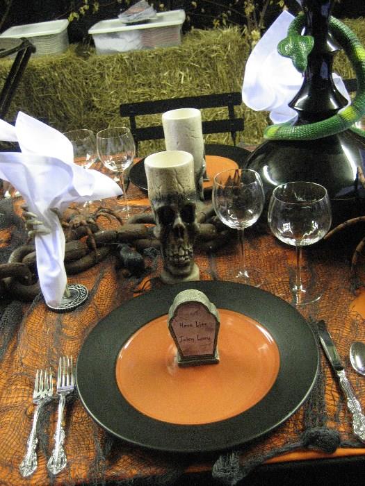 Dinner ware from Pottery barn, snakes, vases, mesh, black lights, etc. All you need to put on a Halloween Dinner grave yard party.