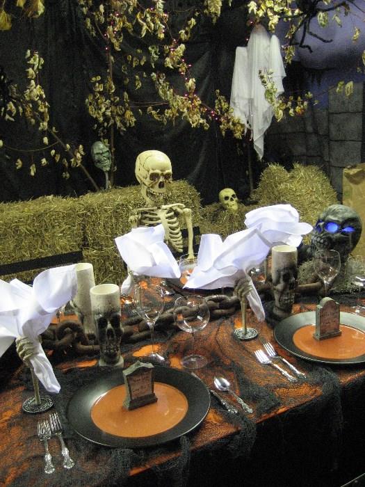 Pottery Barn dishes service for 16. Napkin holders, Full size skeletons,  skull glasses, table cloths etc.