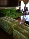 Foreground-Pair of Champagne colored crushed velvet retangular tufted ottomans. Background-Pair of lettuce green crushed velvet loveseats.
