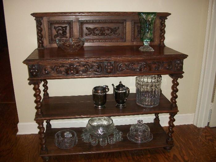 Gothic revival sideboard--Begin to notice fantastic crystal and silverplate
