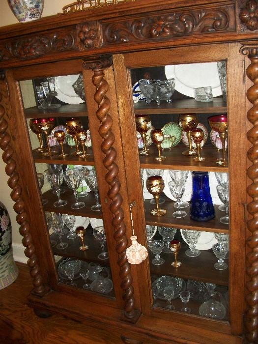 Gothic Revival china cabinet--notice the unbelievable stemware that is packed everywhere