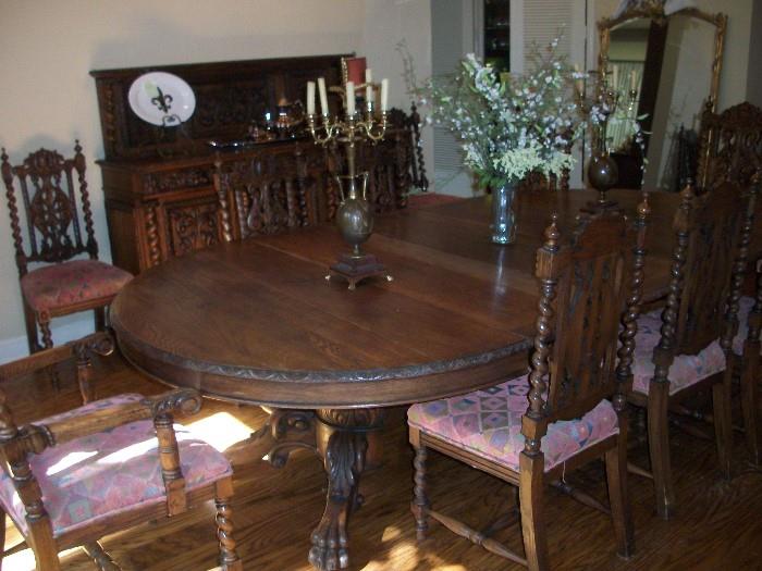 19th century Gothic Revival dining table and 8 chairs.