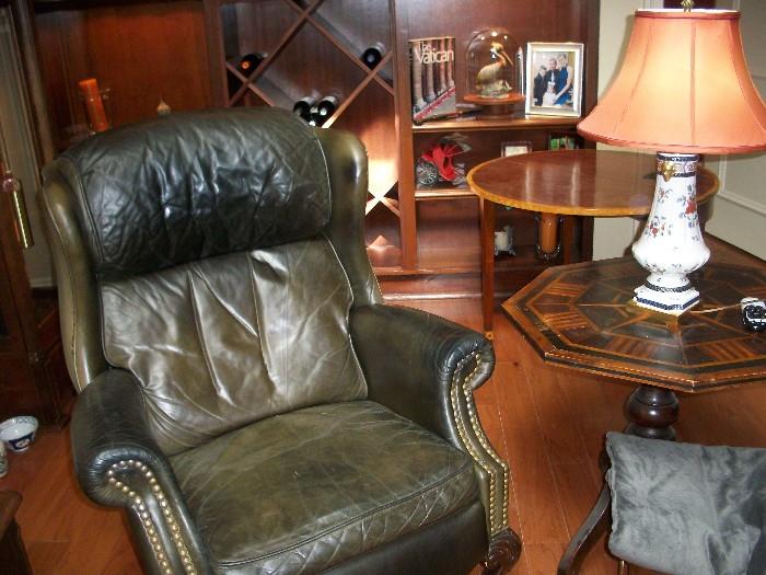 green leather recliner--notice the many magnificent side tables