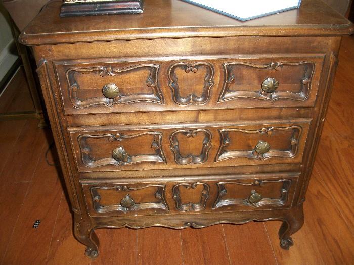 one of two antique small bedside tables