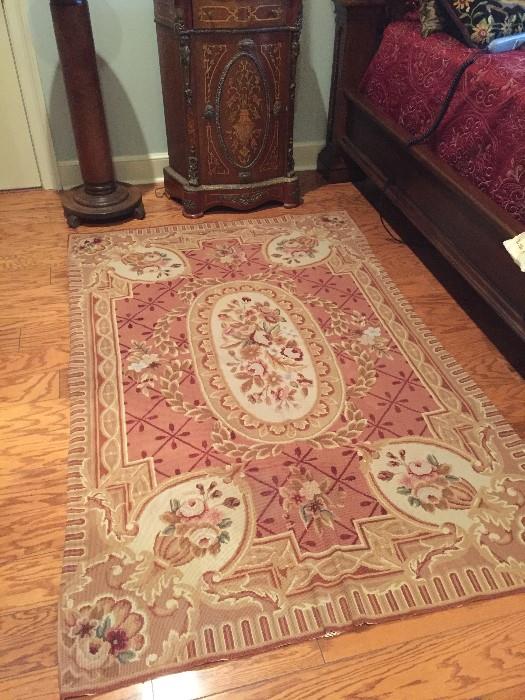 we have three needle point rugs