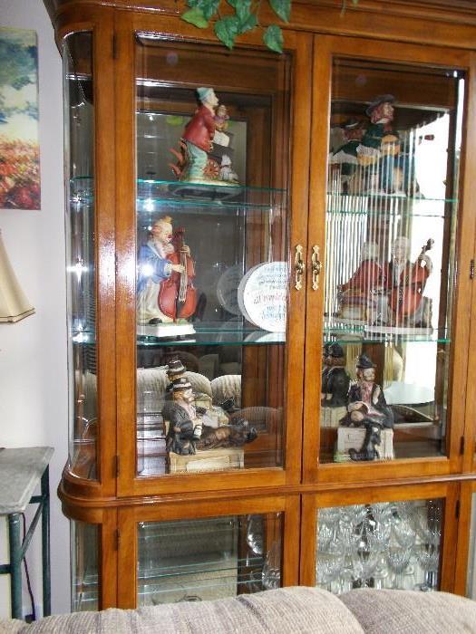 Curio cabinet with clown collection.
