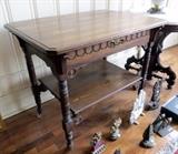 Ornate Oak Table With Lower Shelf And Porcelain Casters 30"H X 35"W X 25.25" D