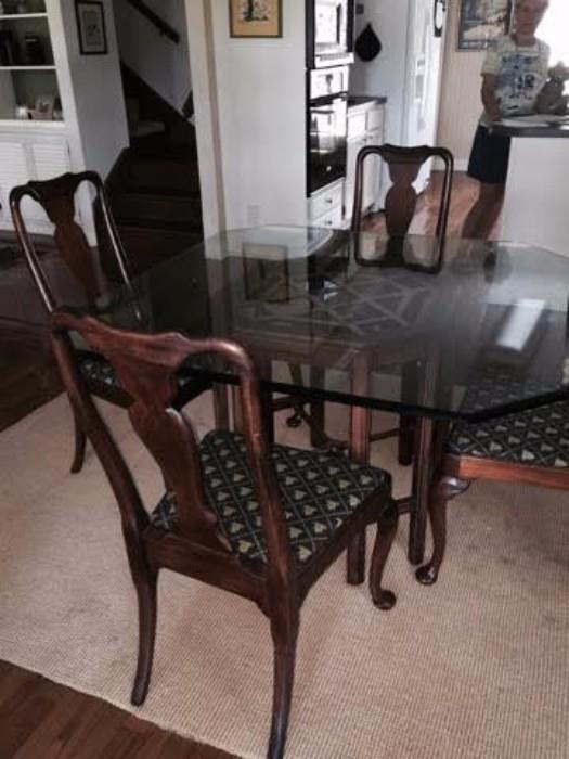 Very nice glass top Chippendale table with four Queen Ann chairs.  Excellent condition.
