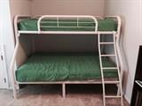 Bunk bed set with mattresses.