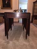 Plantation dining room table with leaves dropped.