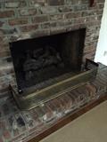 Solid brass fireplace fender.
