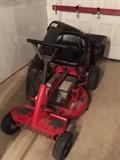 Snapper riding mower with bag attachment.