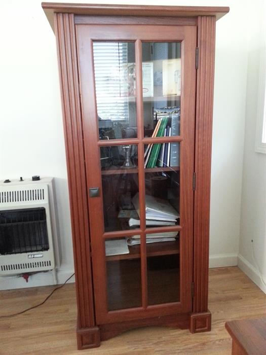 Tall glass front media cabinet