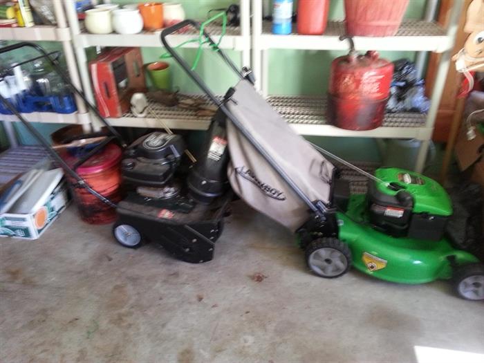 Green self propelled mower with bag and snow blower