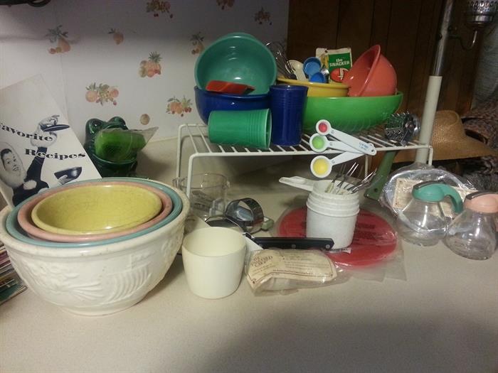 Vintage mixing bowls, Fiesta, lots of kitchen utensils and cookware.