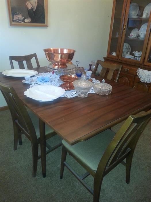 Hooker table with drop leaf and four chairs. Like new Copper punch bowl and cups along with other Copper serving pieces.
