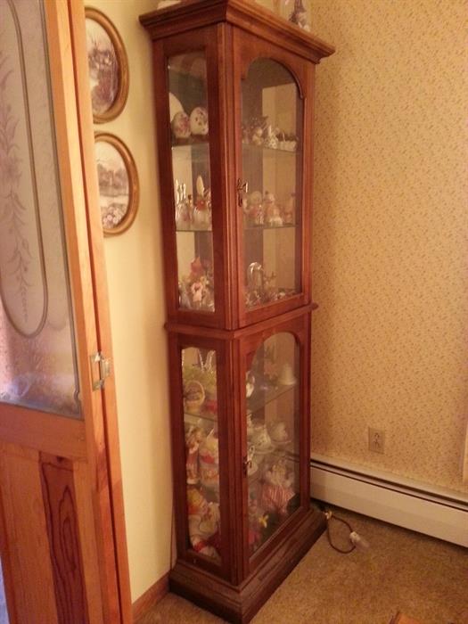 Cherry lighted curio cabinet.