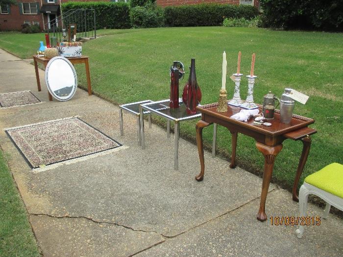 I have 4 chrome tables, 2 sides and 2 coffees. Fine cherry table, $150.