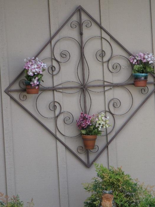 Wrought iron wall piece.