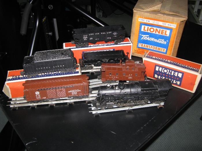 Vintage Lionel train with engine and 5 cars.  Transformer.  Lots of track, switches, and more!