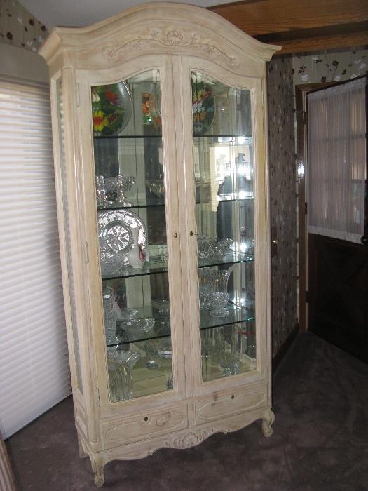 French Provincial style lighted display cabinet.