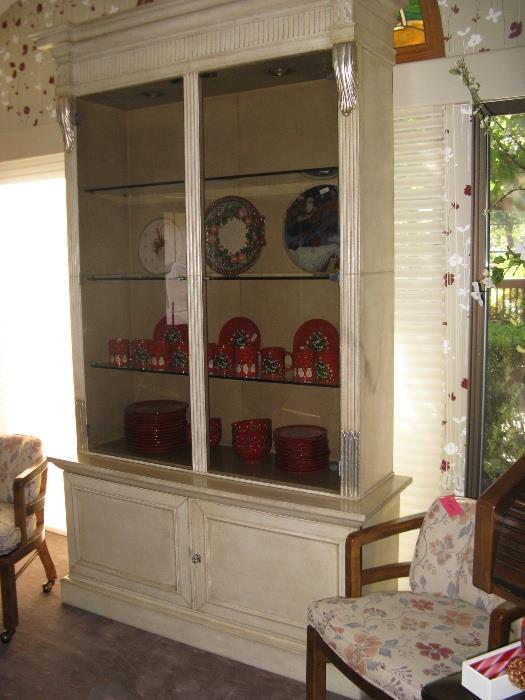Beautiful 2-part Regency style lighted display cabinet.