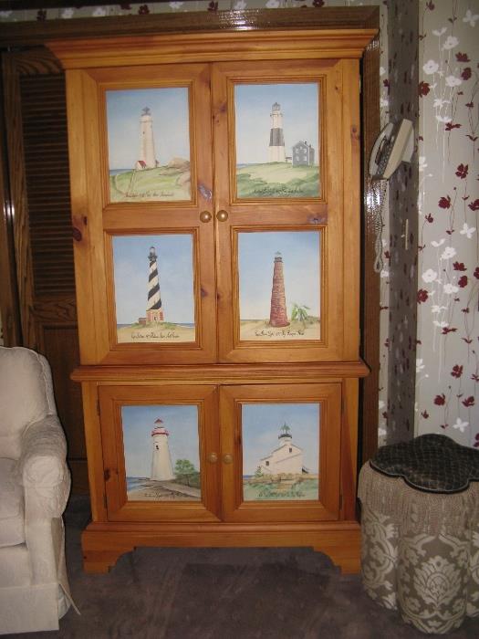 Charming "Lighthouse" Armoire.  Each light house is a hand painted picture of an actual lighthouse with its name and location cited.