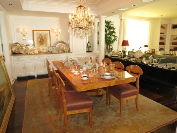 Beidermeier Pedestal Dining Table with Two Leaves & Eight Chairs, on an Antique Persian Rug; a Heavy Louis XV-Style 16 Light Crystal Chandelier; an assortment of Fine China, Crystal and Silver.