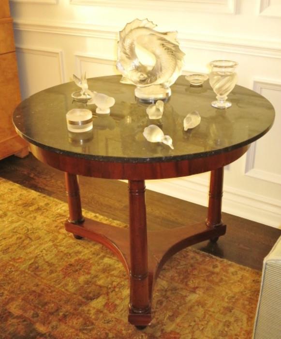 A 19th. C. Empire Marble-Top Hall Table with a fine selection of Lalique Crystal.