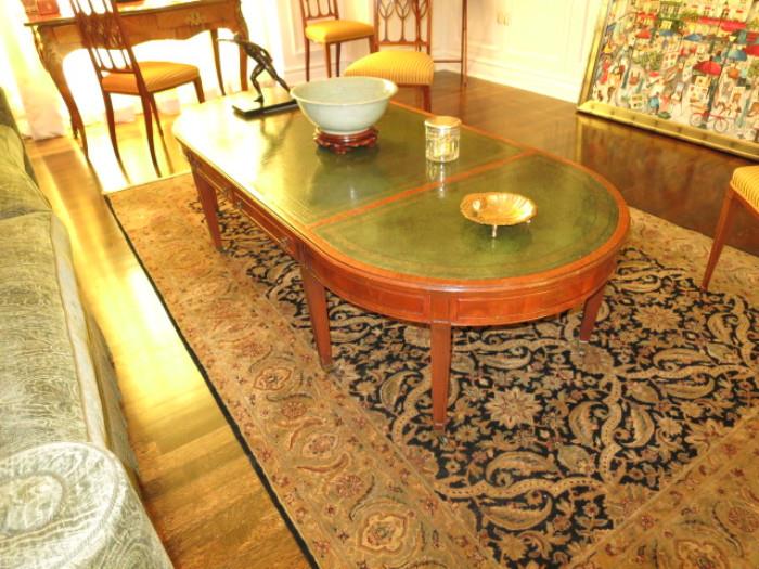 Oval Regency-Style Flame Mahogany Coffee Table with Leather Top; an Archaistic Celadon Bowl; on a Persian Rug