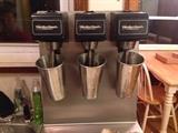 Commercial milk shake machine. Has three speeds, rust proof, and comes with mixing cups.