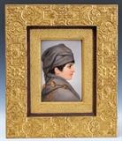 Lot#14: KPM Porcelain Plaque
 Profile of a Boy 9 1/2" x 6 1/4" stamped verso KPM with scepter logo retaining original aesthetic movement frame