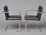 Lot #21: Pair of Brno Chairs
 by Gordon International with black leather seats 32" high late 20th century