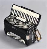 Lot# 32b: Art Deco Bell Accordion
 high gloss black finish with silver mesh cut outs in original case
