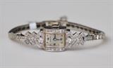  Lot#55: Hamilton Platinum and Diamond Ladies Wrist Watch
 with original 14k gold and diamond band 14.3 dwt gross circa 1940