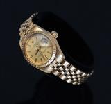 Lot#58:Ladies Rolex Presidential 18k Gold Wristwatch
 with date aperture, and original 18k gold band signed "Rolex Oyster Perpetual Datejust Superlative Chronometer Officially Certified"