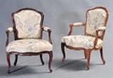 lot 68: Two Louis XV Fauteuils
 virtually identical, one in oak and one in beechwood 33" high one 18th century, one possibly later date