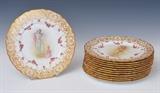 Lot 74: Set of 12 Doulton Cabinet Plates
 the borders with gilt enameling and painted garlands and the centers each with a different scene of a mother and child retailed by Ovington Bros. late 19th century